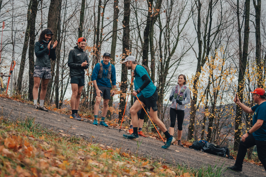 Alister Gardner running up Mont Bromont during an Everesting challnege accompanied by some cheering friends  